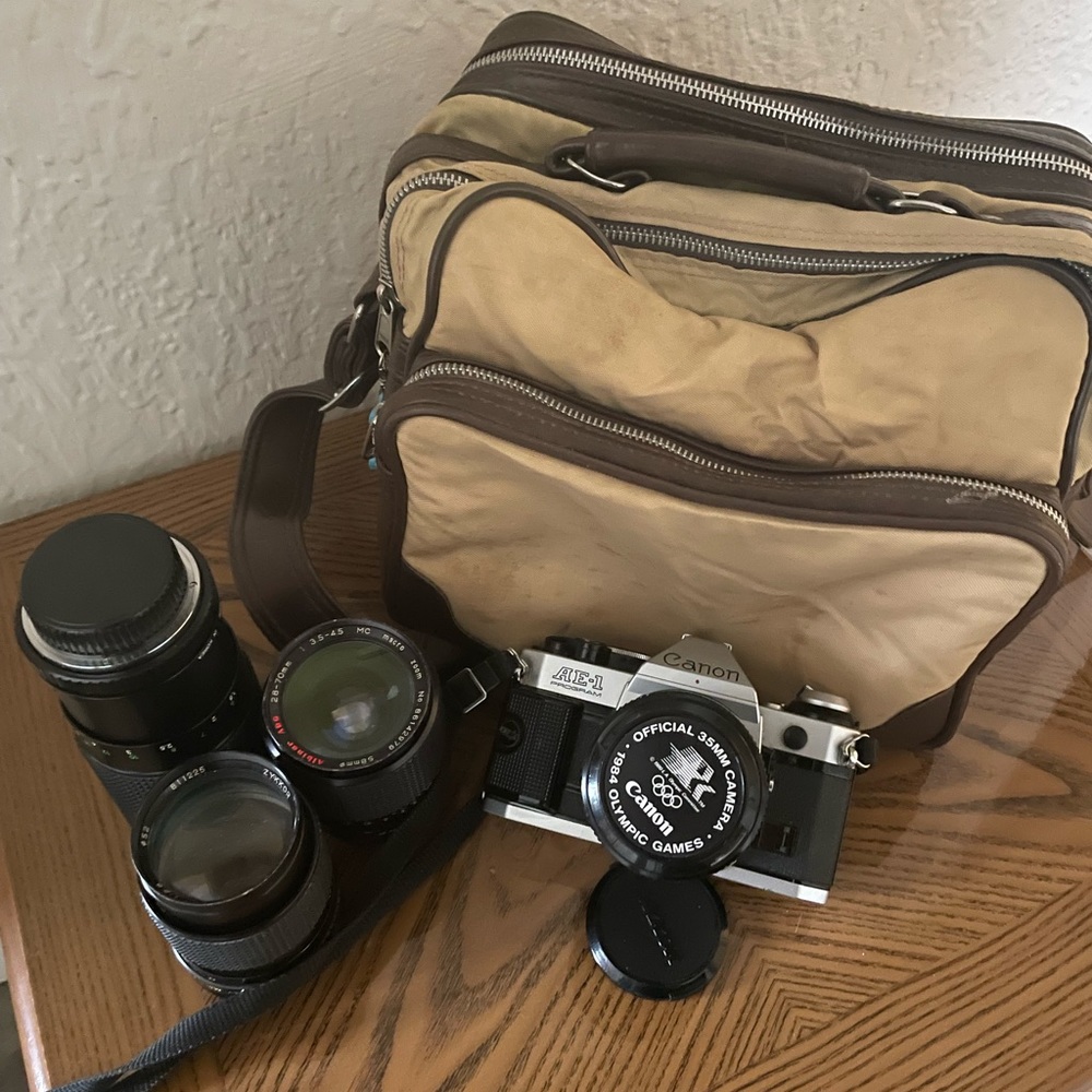 Canon AE one program camera with bag and accesories
